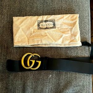 Black Gucci Belt with Large Gold Lettering.